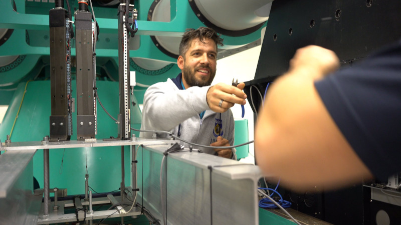 Technician making repairs to a centrifuge at the NGCF in WA.